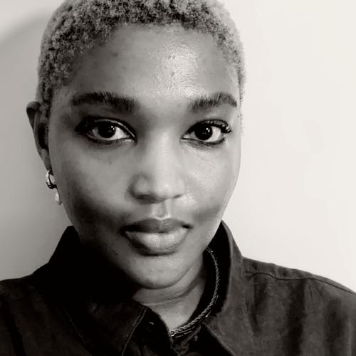 Faustine in front of a light coloured wall - photo has black and white filter applied